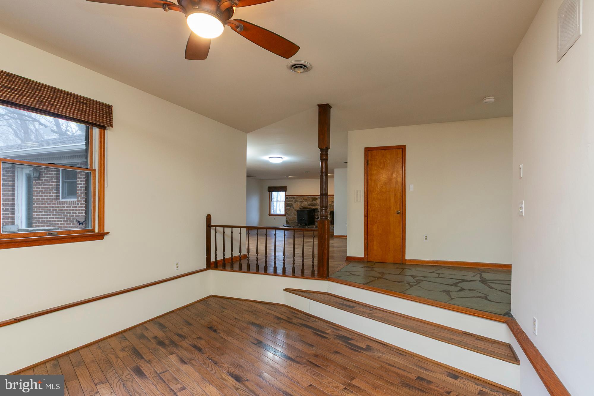 35 Grant Road Kearneysville, WV 25430 - Photo 16 of 122 a view of a livingroom with wooden floor