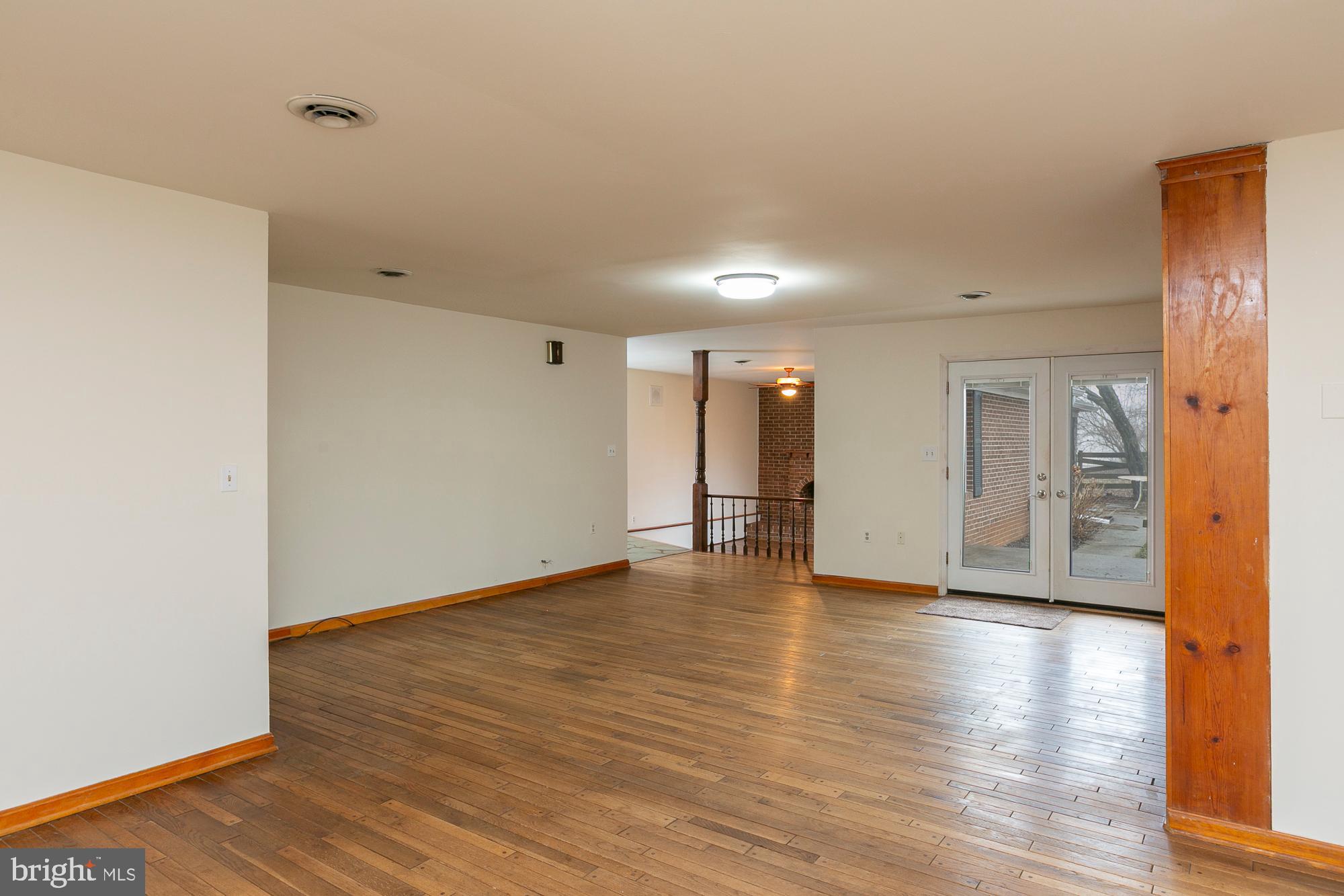 35 Grant Road Kearneysville, WV 25430 - Photo 24 of 122 a view of an empty room with wooden floor and a window