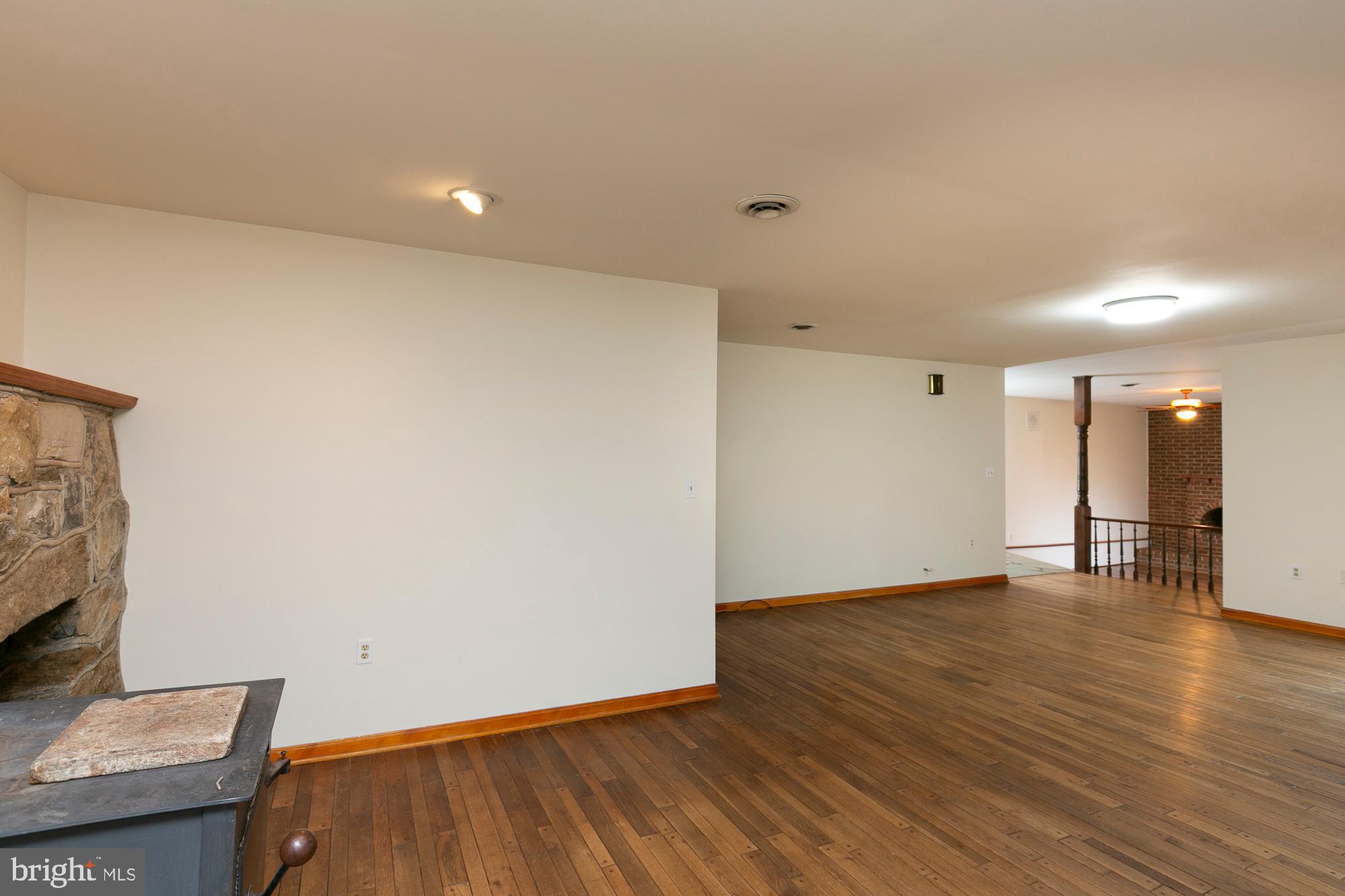 35 Grant Road Kearneysville, WV 25430 - Photo 25 of 122 a view of an empty room with wooden floor