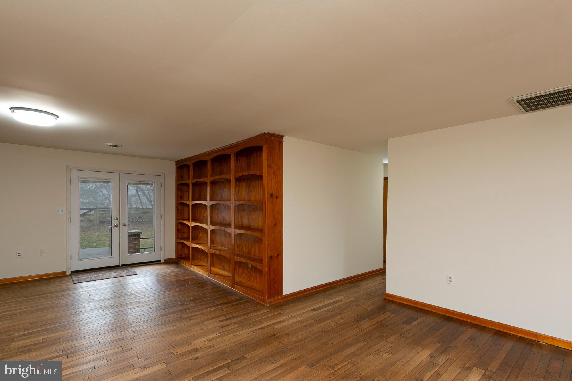 35 Grant Road Kearneysville, WV 25430 - Photo 27 of 122 a view of an empty room with a closet and wooden floor