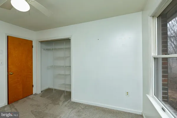a kitchen with stainless steel appliances granite countertop a stove top oven a refrigerator and cabinets