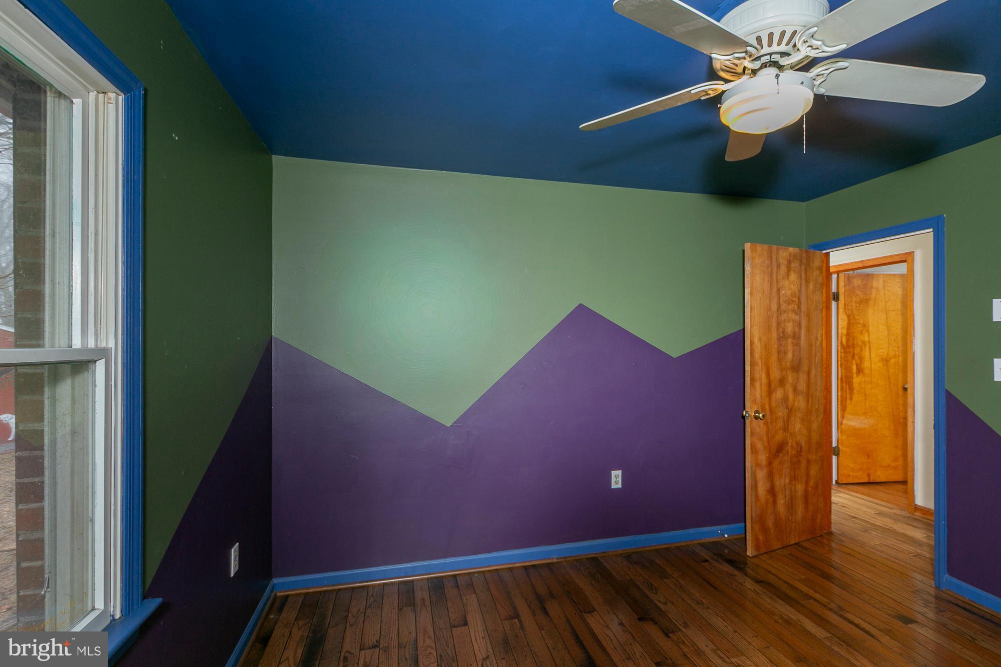 35 Grant Road Kearneysville, WV 25430 - Photo 56 of 122 a view of a room with a ceiling fan and wooden floor