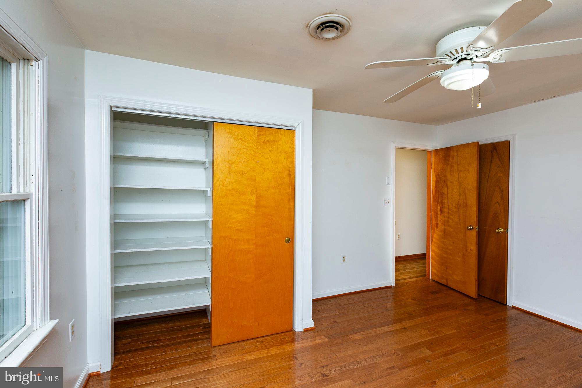 35 Grant Road Kearneysville, WV 25430 - Photo 62 of 122 a view of an empty room with wooden floor and a window