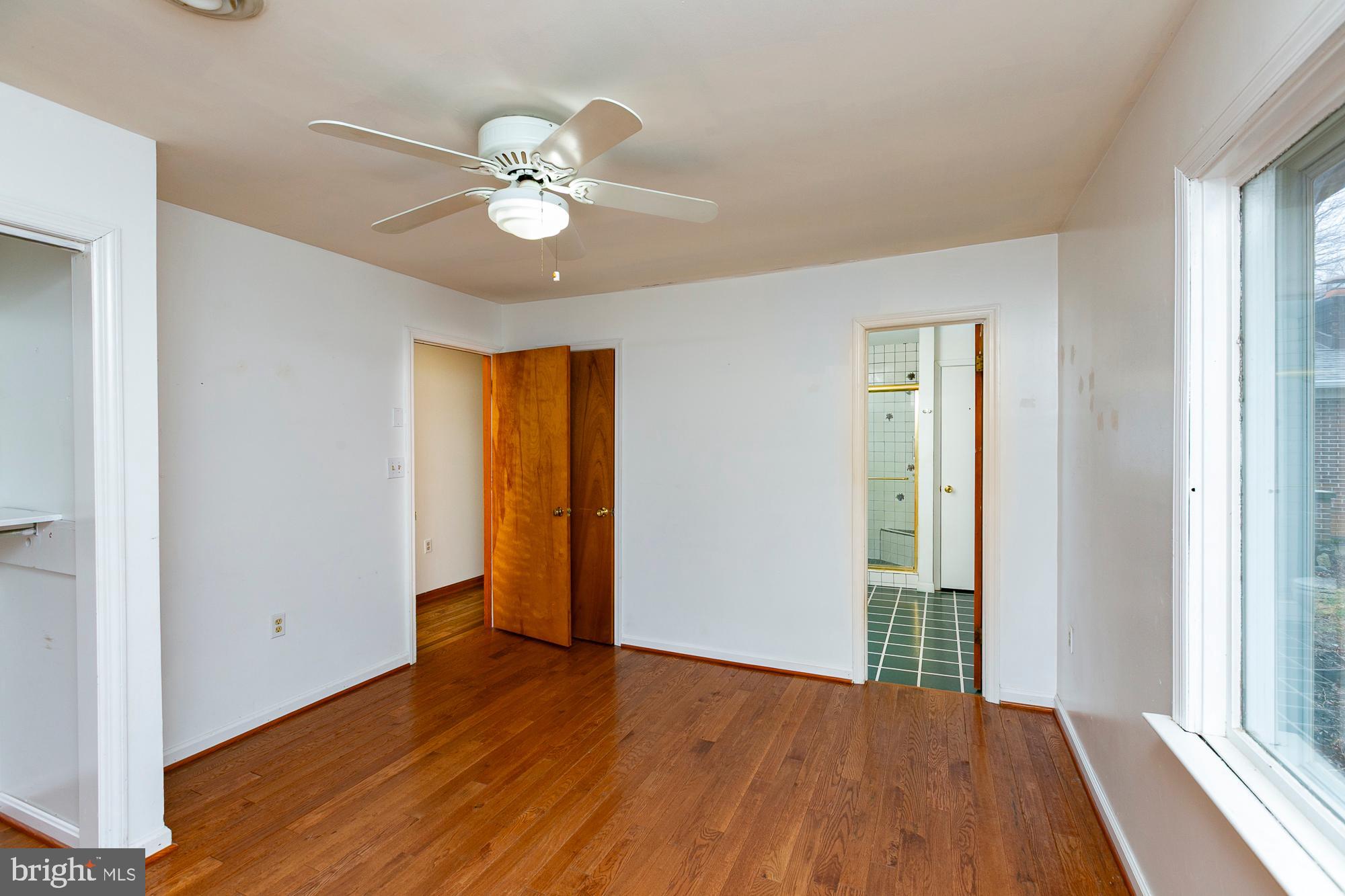 35 Grant Road Kearneysville, WV 25430 - Photo 63 of 122 a view of an empty room with wooden floor and a window