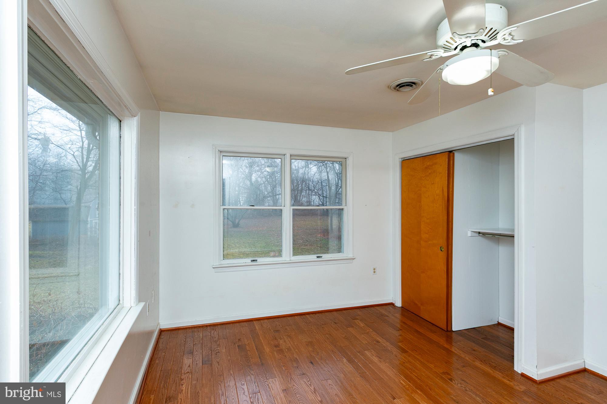 35 Grant Road Kearneysville, WV 25430 - Photo 64 of 122 a view of an empty room with a window and wooden floor