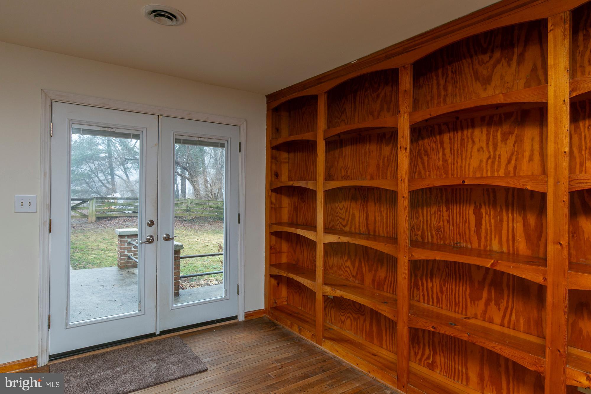 35 Grant Road Kearneysville, WV 25430 - Photo 74 of 122 a view of an empty room with wooden floor and a window