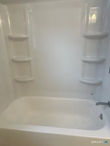 a bathroom with bathtub