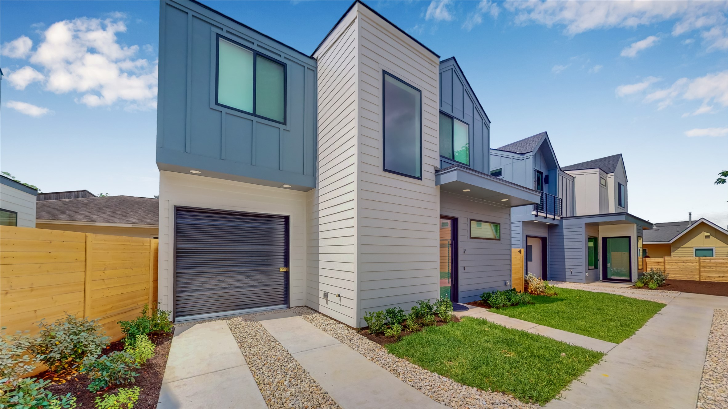4424 Hank Avenue, Unit 2 Austin, TX 78745 - Photo 1 of 11 A striking modern facade with clean lines and mixed materials creates captivating curb appeal.