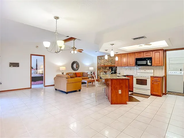a living room with fireplace furniture and a flat screen tv