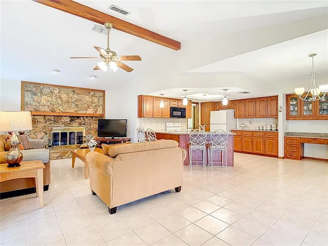 a kitchen with a sink stove and microwave