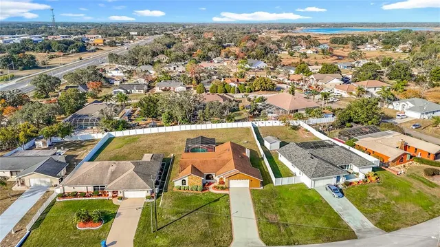 an aerial view of a house with a swimming pool