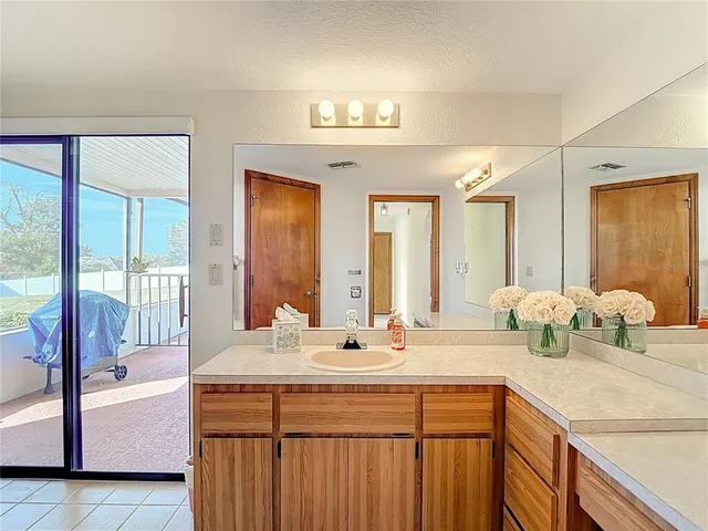 a view of a room with wooden floor and windows