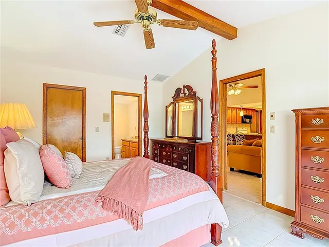 a balcony with furniture and a potted plant