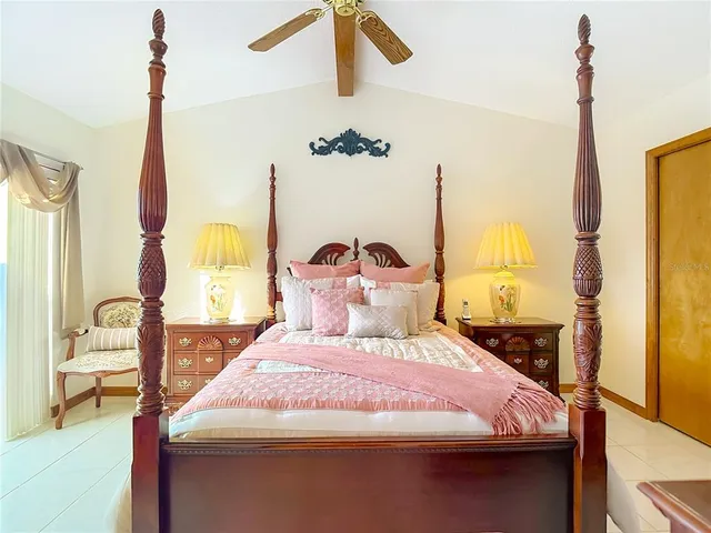 a living room with furniture a flat screen tv and a table