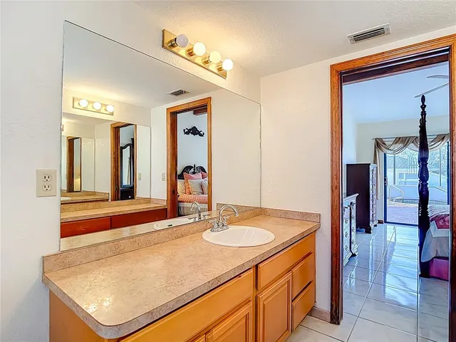 a view of a swimming pool with a sink and wooden floor