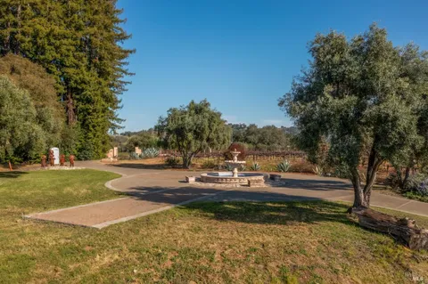 a view of a yard with swimming pool