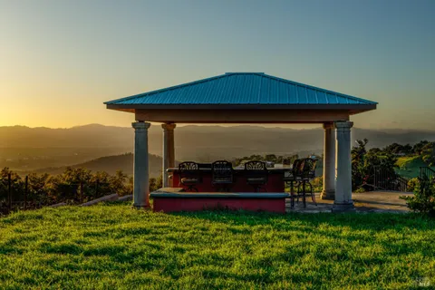 a view of a water fountain in front of a house
