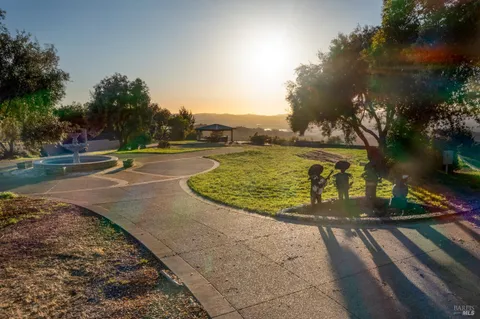 an aerial view of residential building and lake