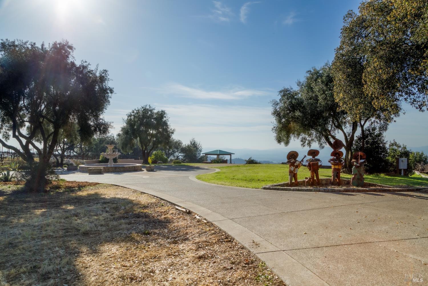 1980 Redwood Hill Court Santa Rosa, CA 95404 - Photo 5 of 49 a view of swimming pool with outdoor seating and trees in the background