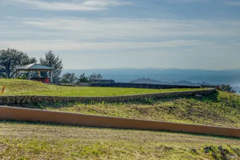 a view of a yard with an ocean