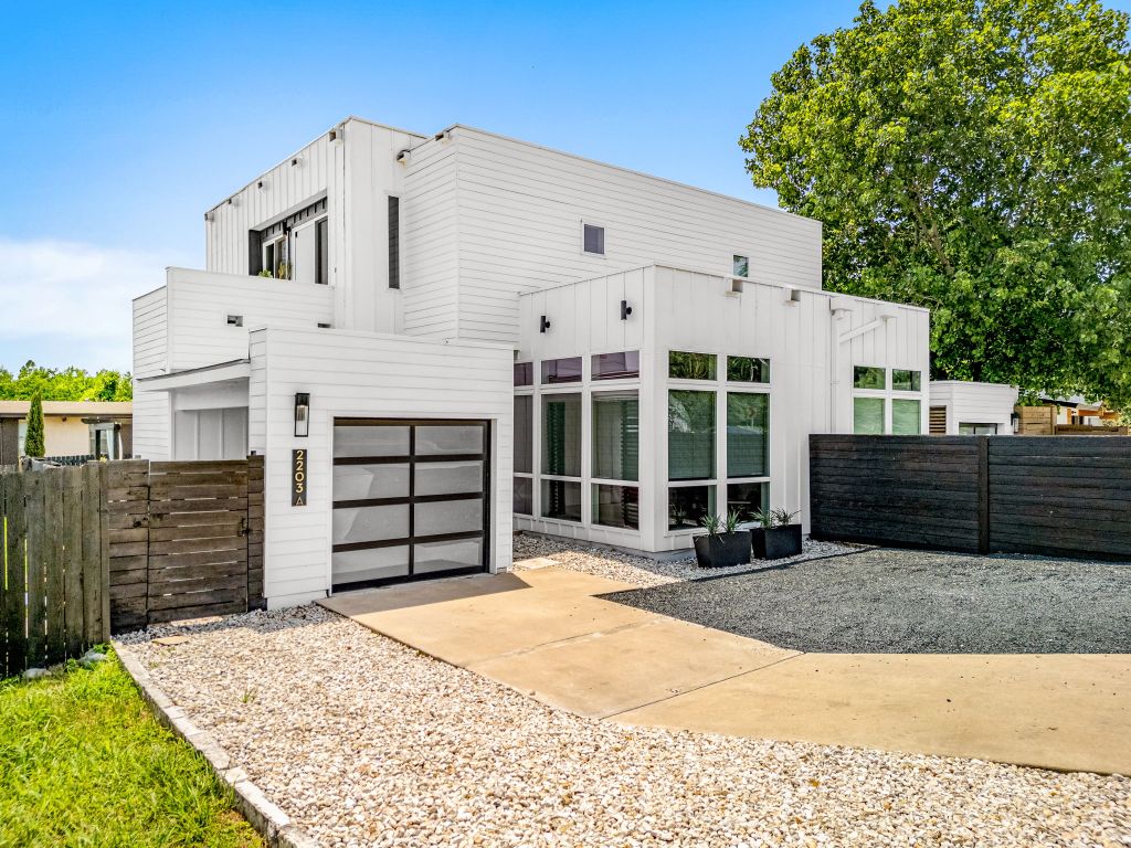 a front view of a house with a garage