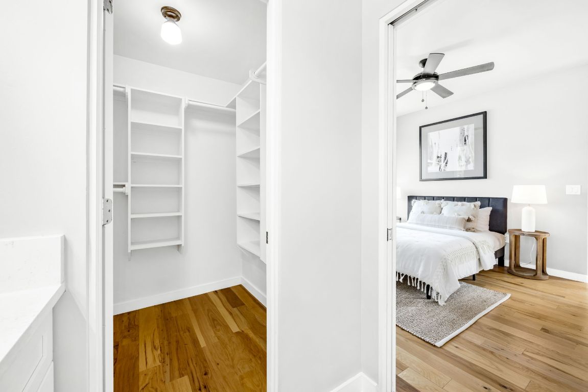 2203 East 51st Street, Unit A Austin, TX 78723 - Photo 17 of 25 a bedroom with a bed and a painting on the wall