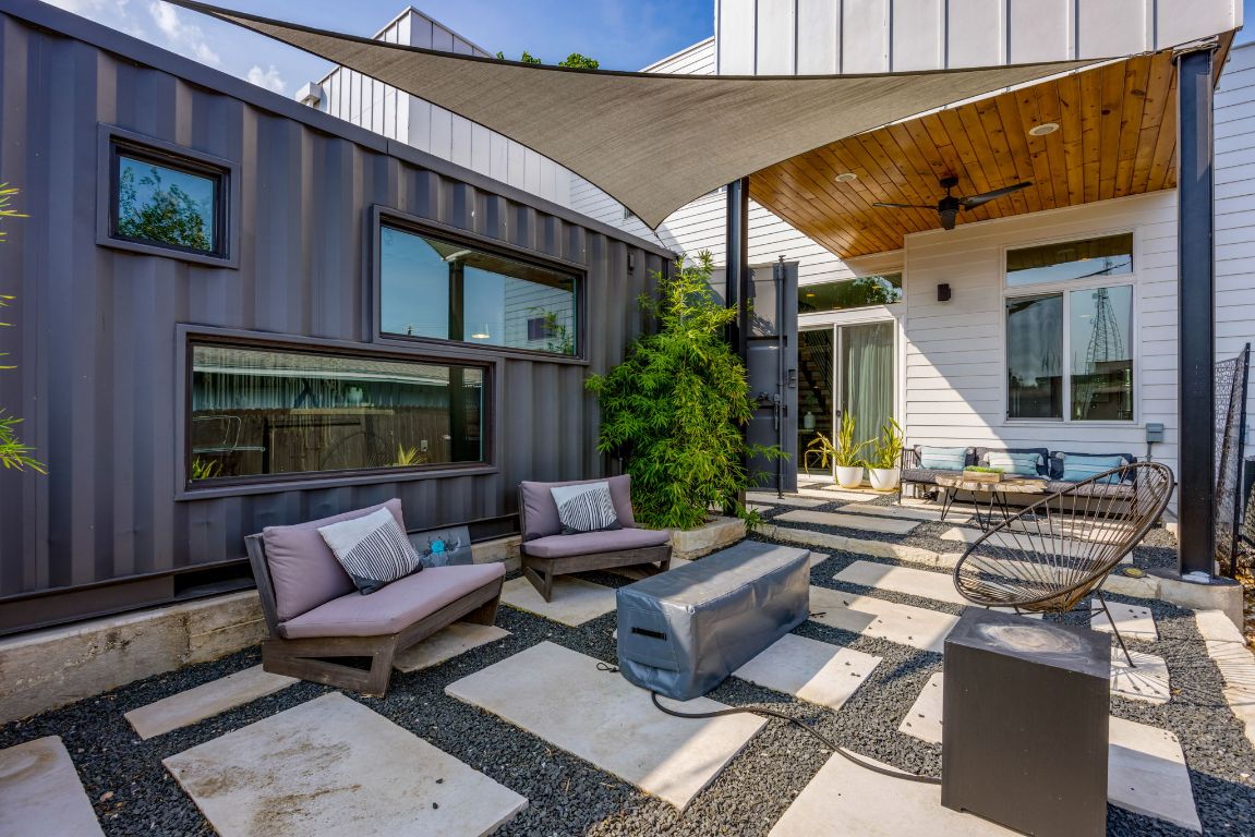 2203 East 51st Street, Unit A Austin, TX 78723 - Photo 24 of 25 a view of a patio with couches and a table and chairs with potted plants