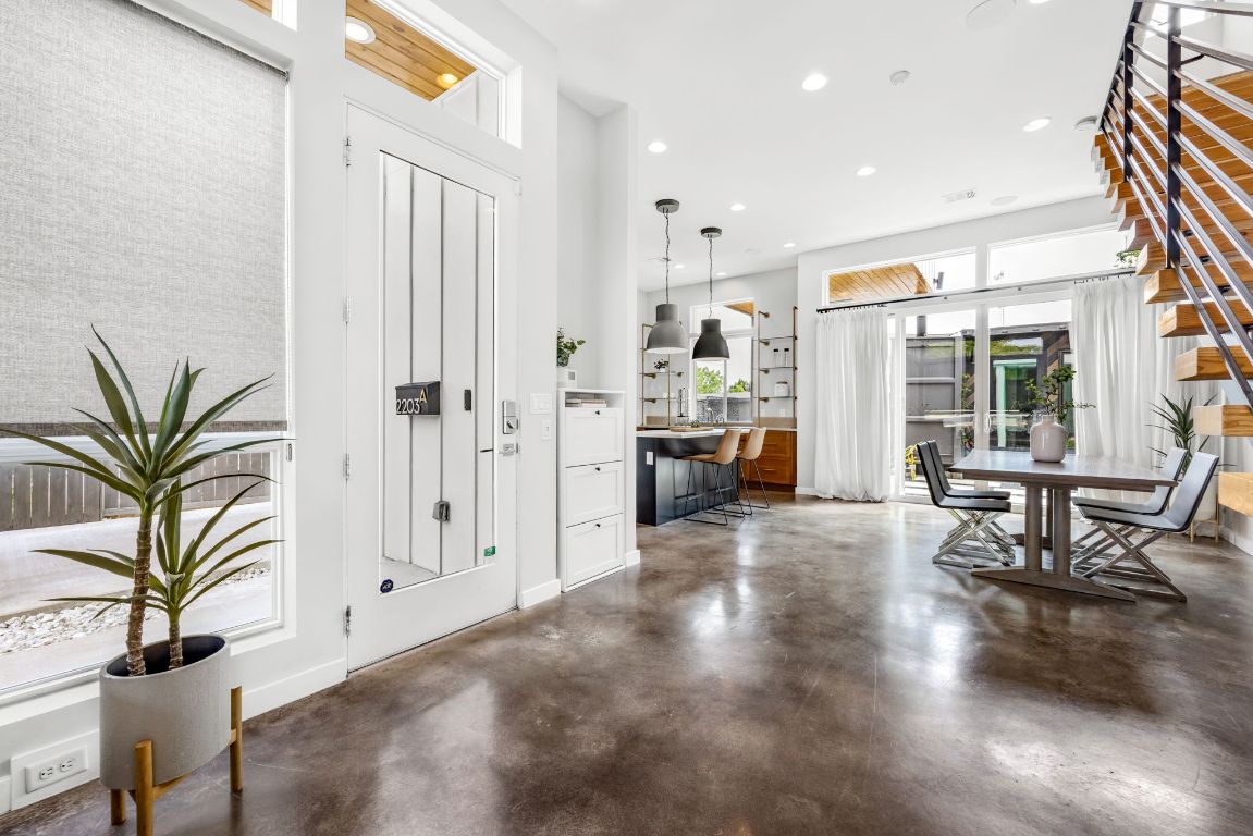 2203 East 51st Street, Unit A Austin, TX 78723 - Photo 5 of 25 a living room with furniture a large window and wooden floor