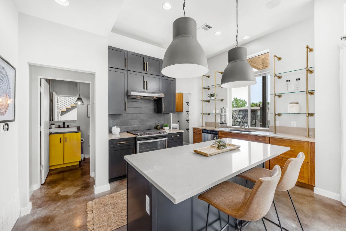 2203 East 51st Street, Unit A Austin, TX 78723 - Photo 6 of 25 a kitchen with a table and chairs in it