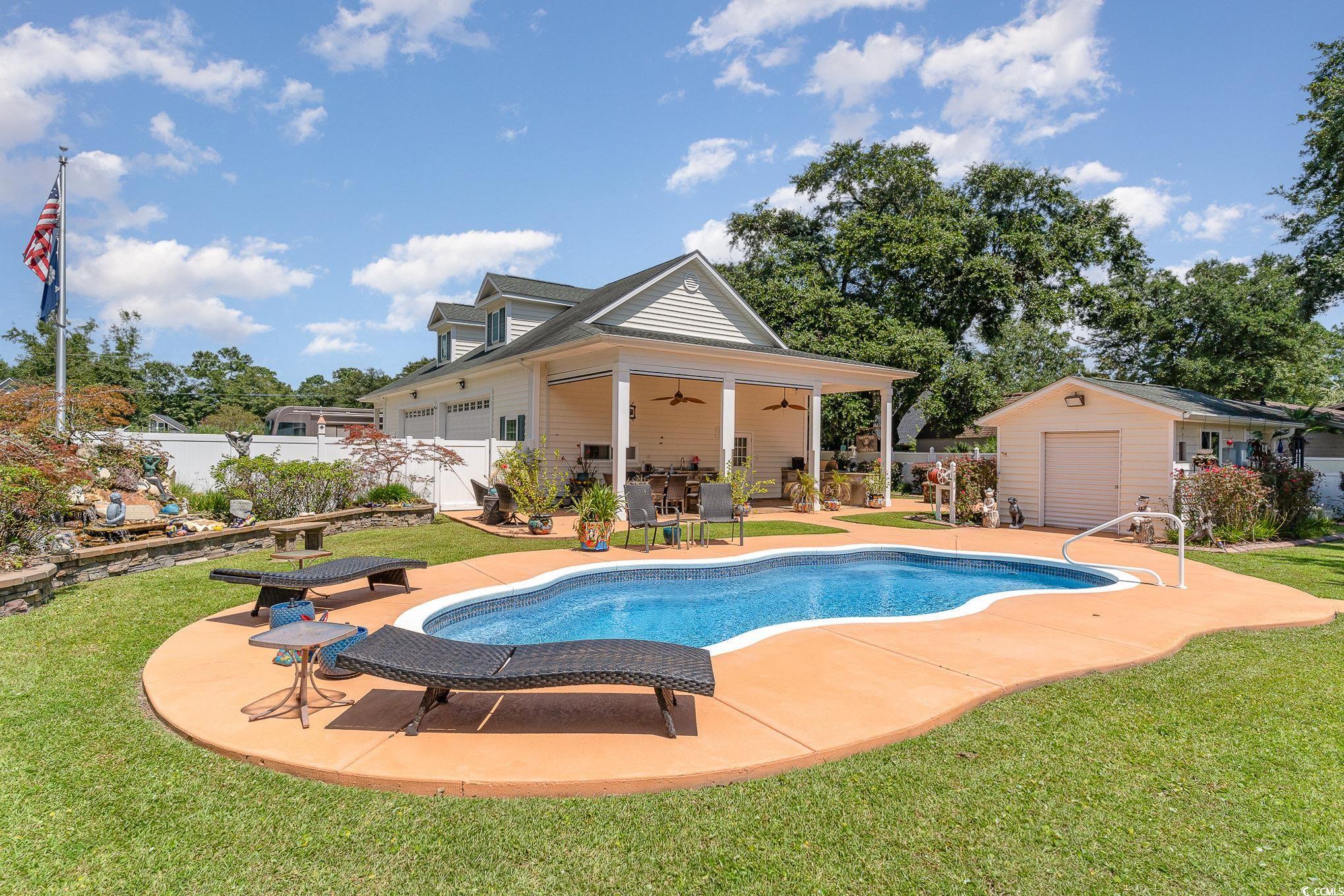 4003 Bayfield Loop Murrells Inlet, SC 29576 - Photo 8 of 40 View of swimming pool with a yard, ceiling fan, a