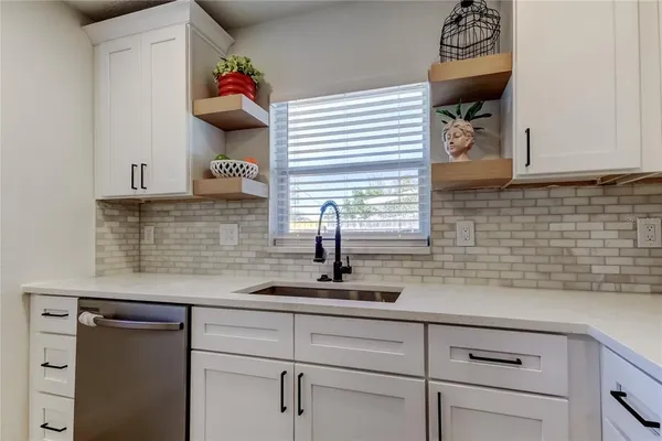 a kitchen with a sink and a cabinets