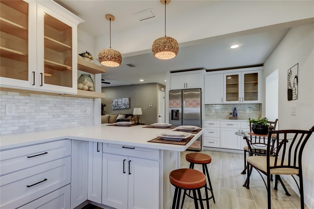 509 11th Street Northwest Largo, FL 33770 - Photo 17 of 36 a kitchen with cabinets appliances and furniture