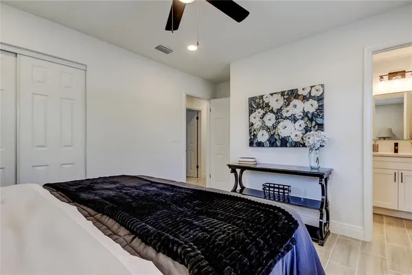 a bedroom with a bed and window