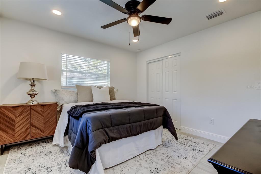 509 11th Street Northwest Largo, FL 33770 - Photo 20 of 36 a bedroom with a bed and window