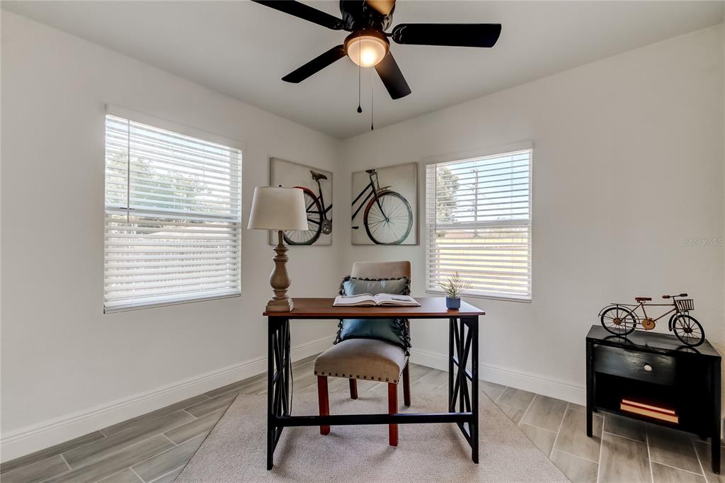 509 11th Street Northwest Largo, FL 33770 - Photo 29 of 36 a view of a workspace with furniture and a window