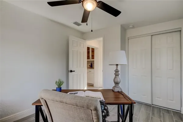 a view of a room with furniture and window