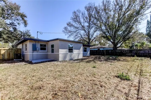 a backyard of a house with lots of green space