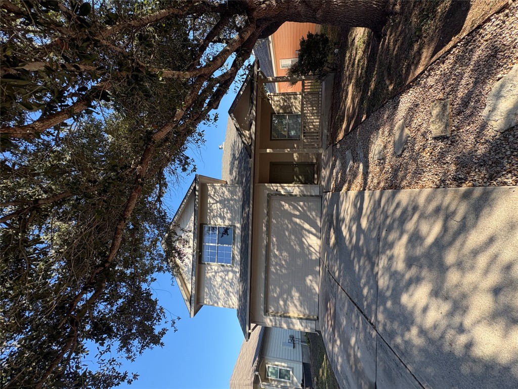 a view of a building with a tree