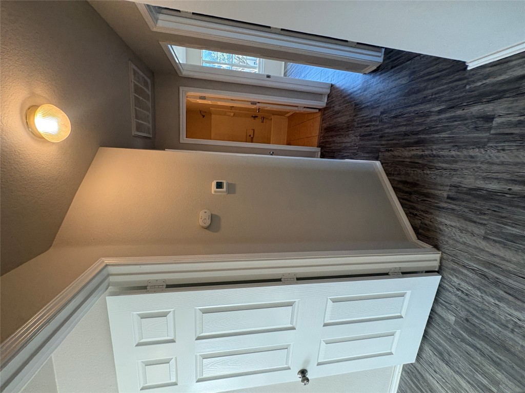 11510 Liberty Street Manor, TX 78653 - Photo 19 of 26 a view of a hallway with wooden floor
