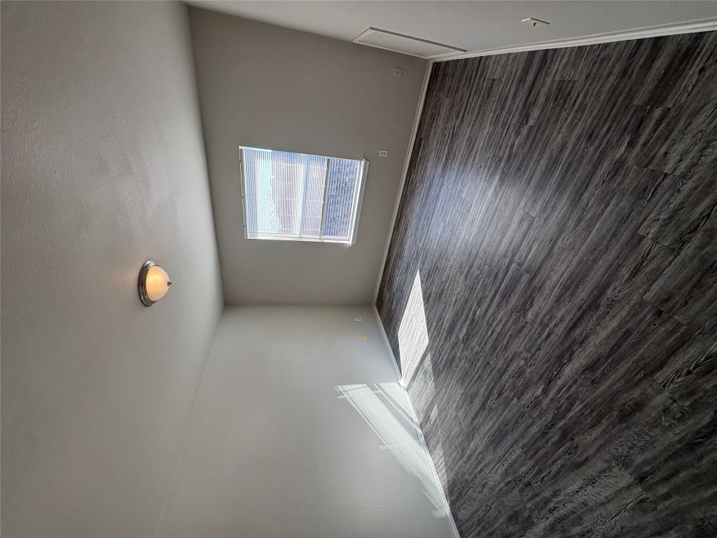 11510 Liberty Street Manor, TX 78653 - Photo 20 of 26 wooden floor in an empty room with a window