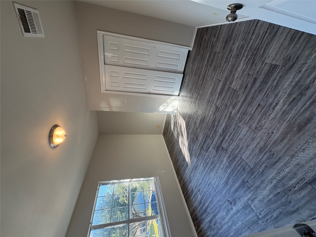 11510 Liberty Street Manor, TX 78653 - Photo 24 of 26 an empty room with wooden floor and windows