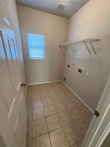 a view of a room with white walls