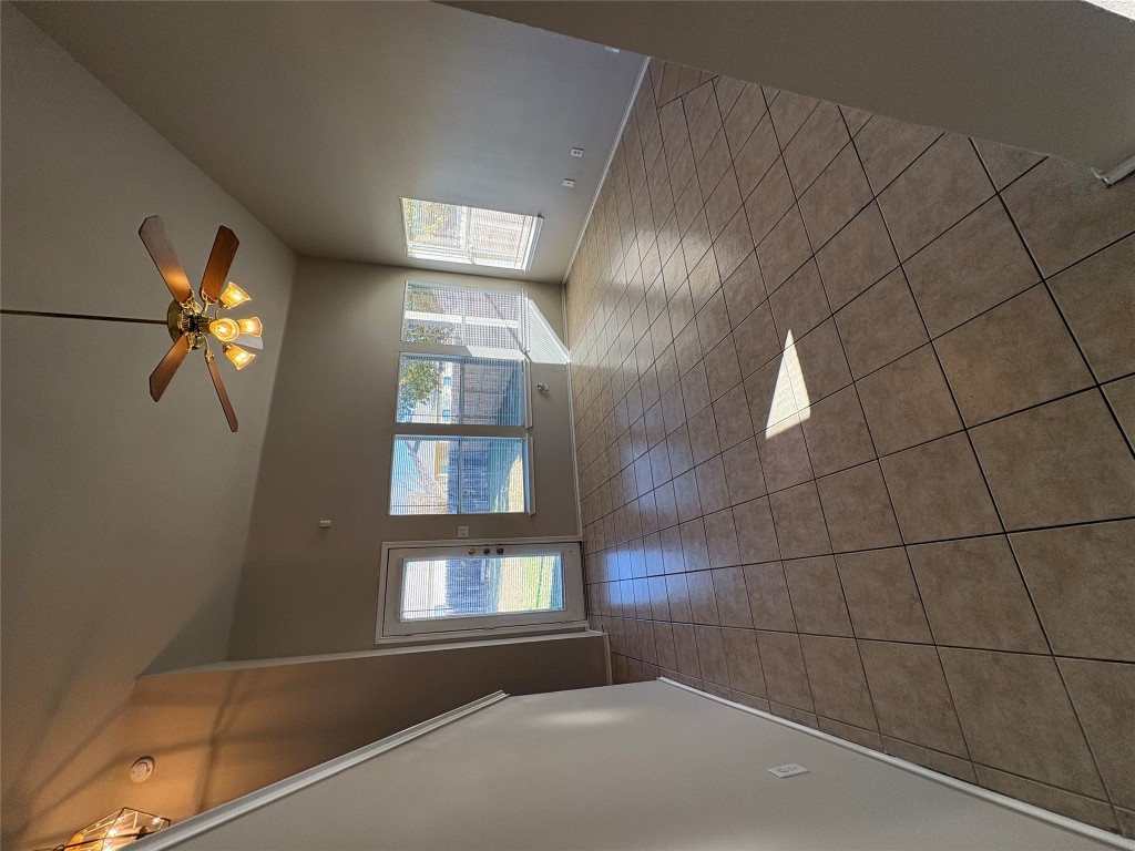 11510 Liberty Street Manor, TX 78653 - Photo 9 of 26 a view of a livingroom with a ceiling fan and window