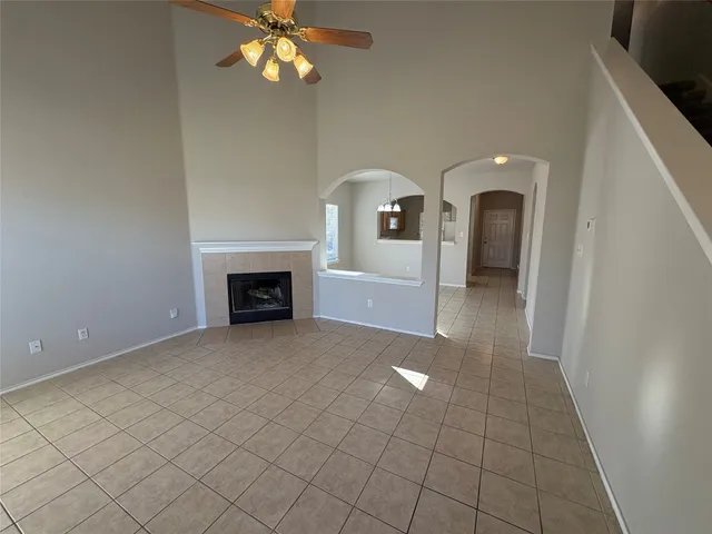 a view of an empty room with a fireplace