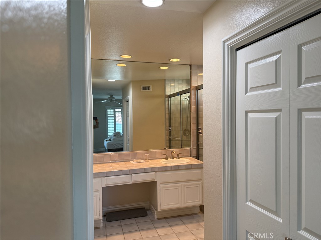 1030 Damascus Circle, Unit 1 Costa Mesa, CA 92626 - Photo 12 of 20 a bathroom with a sink and a mirror