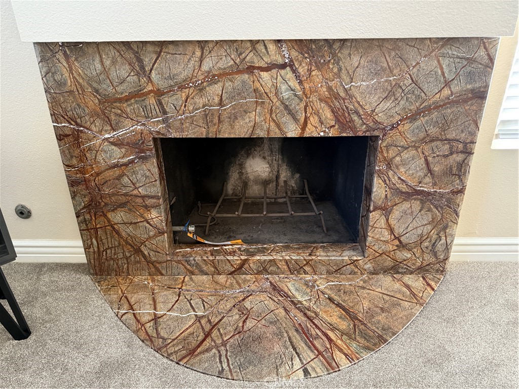 1030 Damascus Circle, Unit 1 Costa Mesa, CA 92626 - Photo 19 of 20 a living room with a fireplace