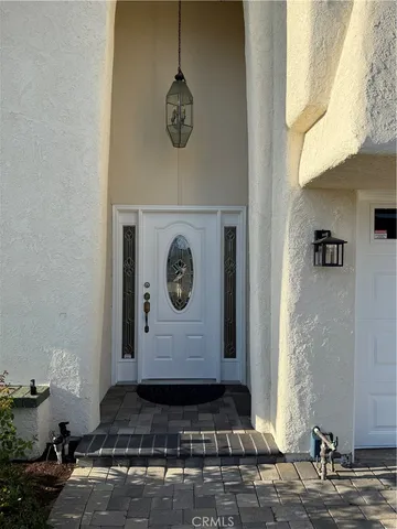 a wooden bench sitting in front of a door
