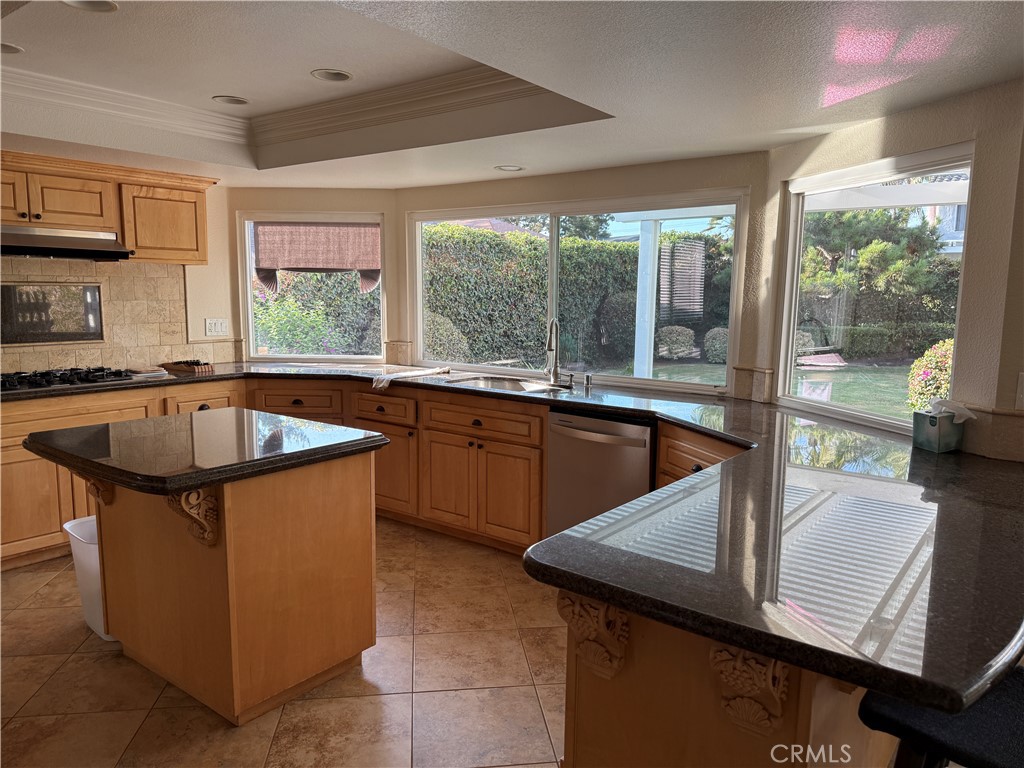 1030 Damascus Circle, Unit 1 Costa Mesa, CA 92626 - Photo 5 of 20 a kitchen with a sink and large windows