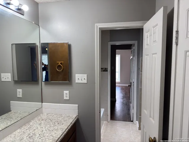 a view of a kitchen cabinets and a counter top space