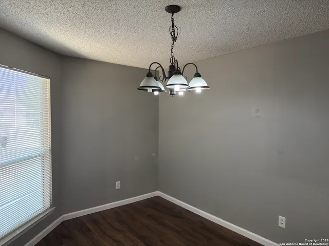 a room with a fan and a window